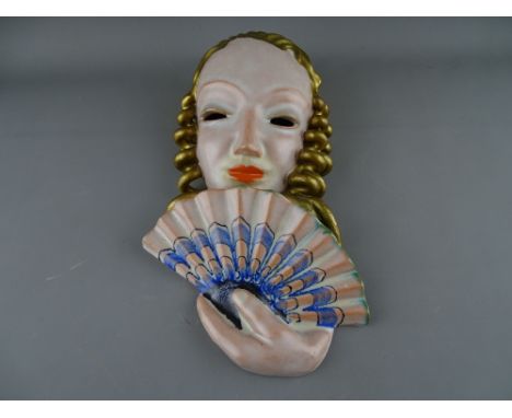 A GOLDSCHEIDER OF AUSTRIA ART DECO POTTERY WALL MASK, indistinct impressed no. with maker's backstamp, 26 cms high