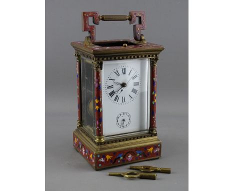 A FRENCH GILT BRASS & CHAMPLEVE ENAMEL REPEATING CARRIAGE CLOCK, the white dial set with Roman numerals above a subsidiary al