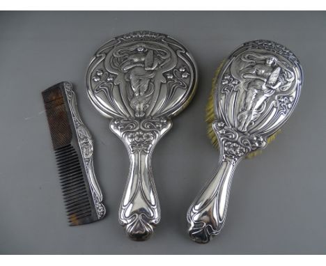 AN ART NOUVEAU SILVER HAND MIRROR, BRUSH & COMB DRESSING TABLE SET, Birmingham hallmarks for 1903 and 1904, 28 cms long the m