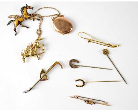 A 9ct yellow gold bar brooch with central cut-out leaf design and small garnet to either side, a yellow and white metal bar b