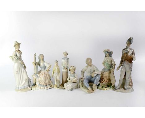 A group of Lladró-style Spanish figures of various form, to include a Nao seated young girl with baby, an 18th century gentle