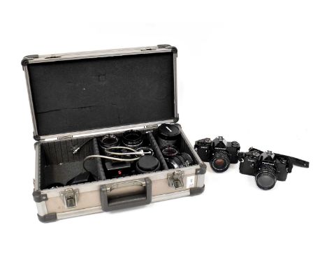 ASAHI PENTAX; a flight case containing a pair of Pentax MX SLR cameras both fitted with Pentax-M 1:1.7 50mm lenses, with eigh
