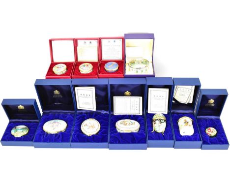 HALCYON DAYS; eleven boxed enamel lidded boxes in various forms, to include Fabergé-style eggs, circular boxes, oval boxes wi