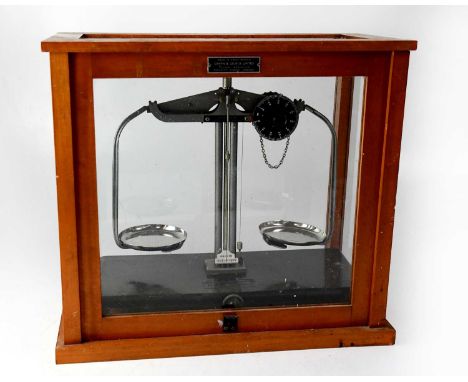 A cased set of laboratory scales by Griffin &amp; George Ltd, the scales mounted on an adjustable base within a glazed wooden