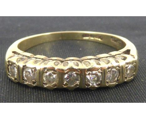 A 9ct gold seven-stone diamond ring, the tiny diamonds approx. 0.25ct, size K, approx. 2.1g.