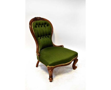 A 19th century Victorian walnut balloon back nursing chair with green upholstered button back and seat, on cabriole legs.Cond