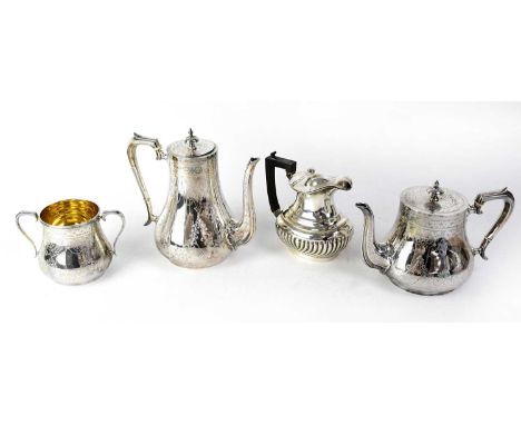 An Edwardian plated gilt three-piece tea service in the Art Nouveau style with etched floral decoration and one other plated 
