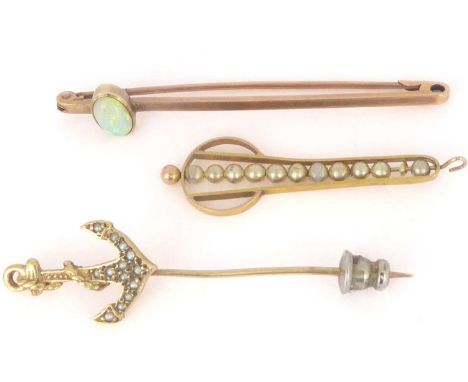 Three late 19th/early 20th century 9ct gold brooches comprising a bar brooch with oval opal, length 5cm, a pin with an anchor