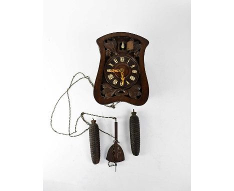 ATTRIBUTED TO JOHANN BAPTISTE BEHA; a 19th century Black Forest cuckoo clock, the dial set with Roman numerals, height 47cm.C