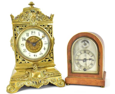 Two vintage desk clocks comprising a mahogany cased dome timepiece, the silvered dome dial set with Roman numerals and keyhol