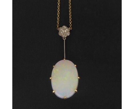 An early 20th century oval opal and diamond pendant in white body, the central cabochon opal 22 x 15mm, suspended on gold cha