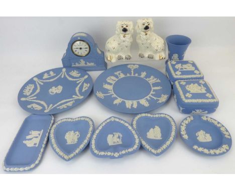 WEDGWOOD; eleven items of powder blue jasperware comprising a small domed top table clock, height 14cm, two square lidded box