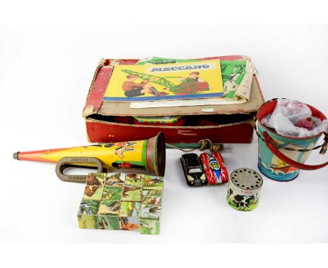 A vintage boxed Meccano set to include construction manual, a baby's wooden block puzzle, tin plate trumpet, a model of a tax