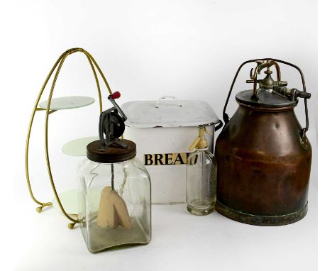 Five kitchenalia items comprising a copper milking apparatus with screw-down lid, a glass butter churning jar, an enamelled b