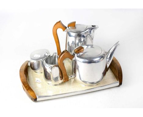 A Picquot ware four-piece tea set and tray with wooden handles, comprising teapot, a hot water jug, a milk jug, a covered sug
