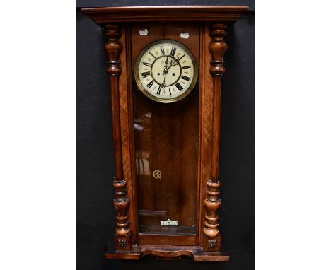 An early 20th century mahogany Vienna-style eight-day wall clock, the cream and red painted dial set with Roman numerals, len