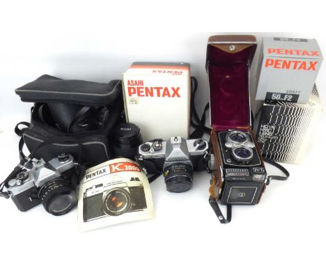 Three vintage cameras comprising a Yashica-M AT Model LM, Copal-MXV in leather case, a Fujica Model STX-1 with lens and a Pen