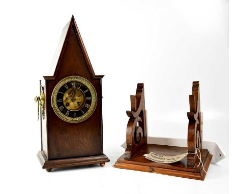 A 19th century eight-day bracket clock, the gilded and black dial set with Roman numerals, in a custom-built oak case, height