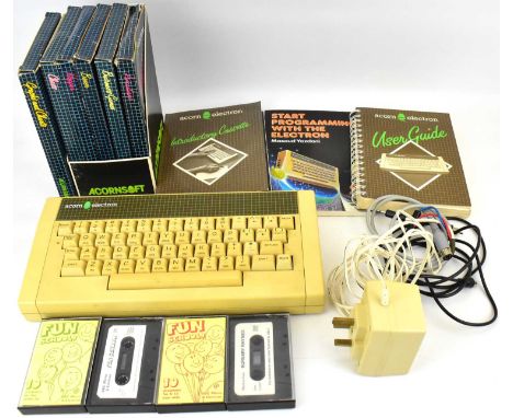 ACORN ELECTRON; a vintage personal computer with user guides, programming books, power pack, various mixed cables, some games