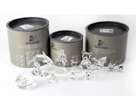 SWAROVSKI; nine Silver crystal figures to include rocking horse, teddy bear, shell with pearl, dolphin on a stand, young girl