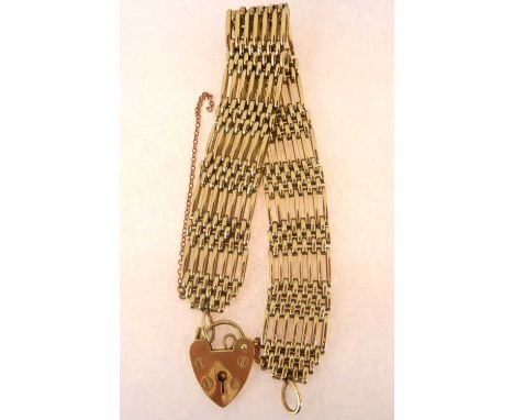A 9ct gold seven bar gate bracelet with 9ct heart-shaped padlock clasp, length 17cm, approx. 26.5g.