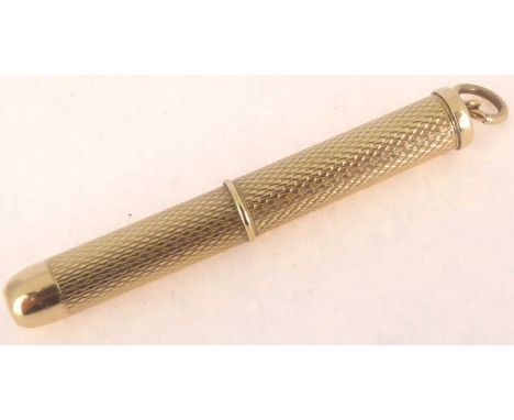 A 9ct gold extending toothpick with engine turned decoration and chain hoop to the top, length 5cm, approx. 6.8g.