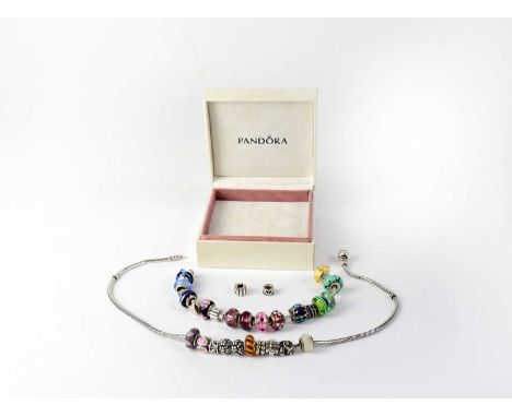 PANDORA; a silver bracelet with various coloured glass and silver charms, stamped 925 and a similar Pandora necklace, in orig