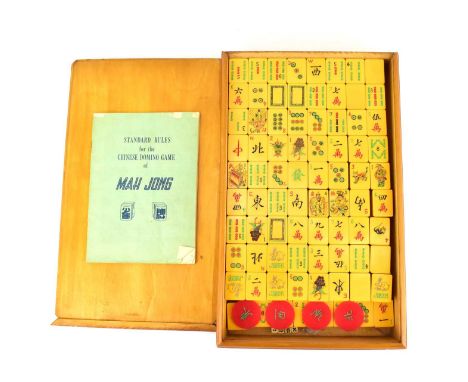 A vintage Mah Jong set in wooden case with text to the front slide, the case 4.5 x 32 x 20cm.Condition Report: Each tile appr