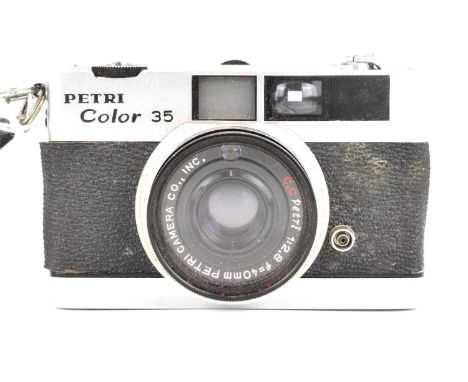 A Petri Color 35 pocket camera in a leather case.