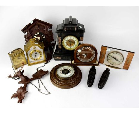 Six clocks to include a Victorian slate mantel clock with inlaid marble detail, a Junghans Meister Quarty carriage-type clock