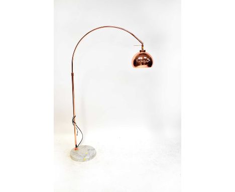 A modern standard lamp with a metal arched branch and domed shade, all in copper tones, on a circular white marble base, heig