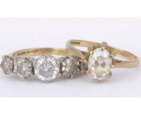 Two 9ct gold dress rings including one with a single marquise cut white stone, size L, the other with five graduated white st