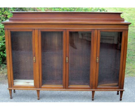 An early 20th C Mahogany and glazed four door bookcase.