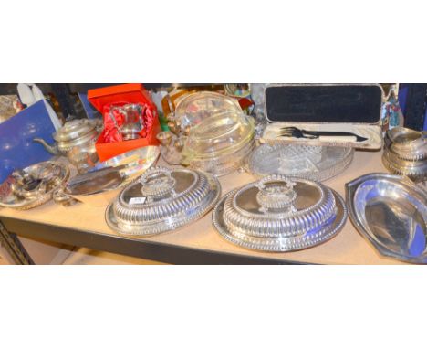 Quantity of silver plate to include a pair of entree dishes, a three piece silver plated tea set etc.,