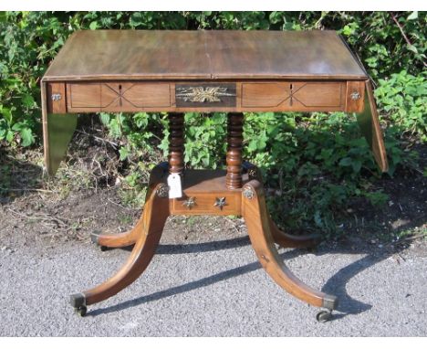 Mahogany and cross banded sofa table on four turned support to four splayed legs and castors (a/f)