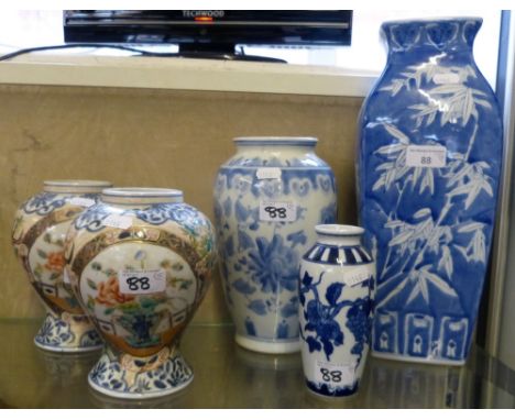 A pair of Chinese ballaster polychrome enamel vases and three Chinese blue and white vases (5)