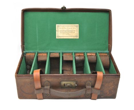 A LEATHER CARTRIDGE MAGAZINE, for approx. 500 cartridges, the interior lined with green baize, with an Army &amp; Navy trade 