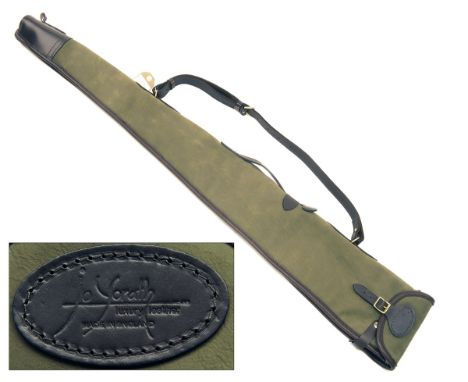 JOANNE YORATH A NEW AND UNUSED OLIVE SUEDE AND LEATHER SHEEPSKIN-LINED SINGLE GUNSLIP, with leather shoulder strap and brass 