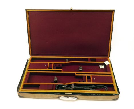 GUARDIAN LEATHER A NEW AND UNUSED BRASS-CORNERED OAK AND LEATHER PRESENTATION DOUBLE GUNCASE, fitted 33in. over and under bar