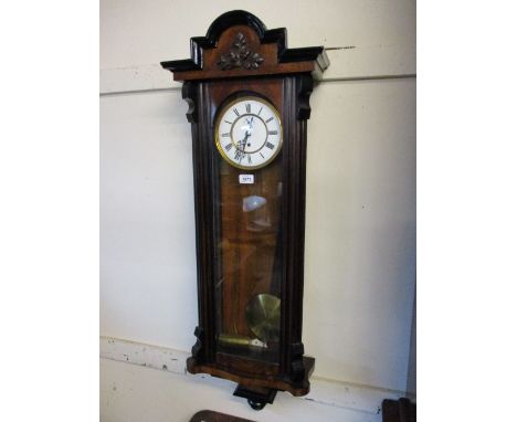 19th Century Continental walnut and part ebonised Vienna wall clock, the enamel dial with Roman numerals and subsidiary secon
