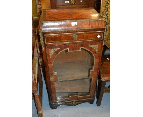 19th Century French kingwood, rosewood and ormolu mounted pier cabinet with a single drawer above glazed door, raised on brac