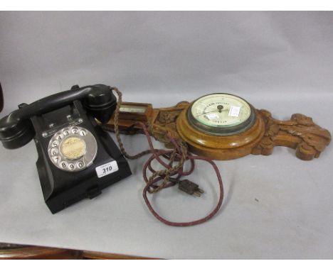 Early 20th Century black Bakelite telephone and an oak aneroid barometer (brass at fault)