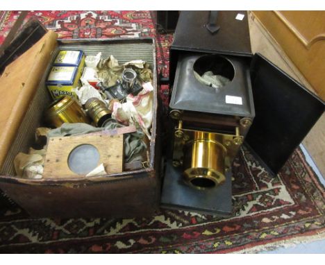 Good quality gilt brass and black japanned magic lantern inscribed Broadhurst Clarkson, London, together with a leather case 