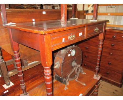 Late Victorian walnut writing table, the leather inset top above two short drawers, stamped Maple and Co. Ltd., raised on rin