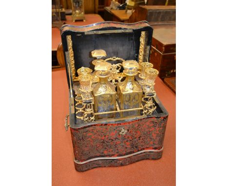 19th Century buhl red stained tortoiseshell and cut brass inlaid decanter box, partially fitted with original contents (at fa