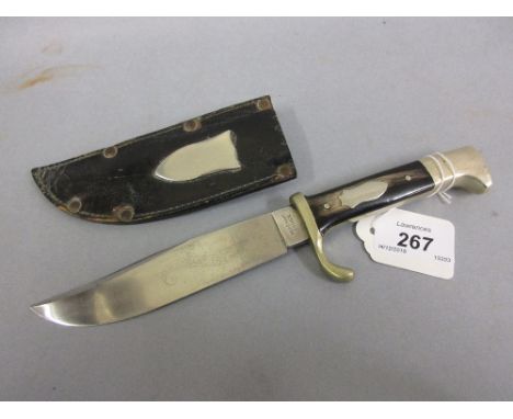 Small early The Bushman's Friend Bowie knife with horn grip in leather scabbard, the blade inscribed Merchant Prince