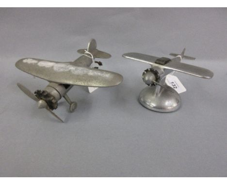 American Demley chromium plated table lighter in the form of an aircraft together with a cast alloy airplane car mascot