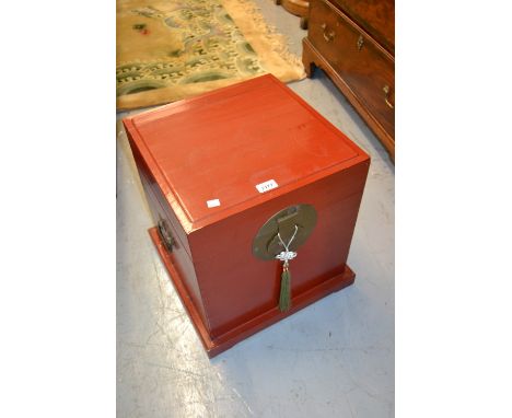 Pair of 20th Century red lacquered Chinese lamp tables / boxes with brass clasps and side handles, on plinth bases, 18ins squ