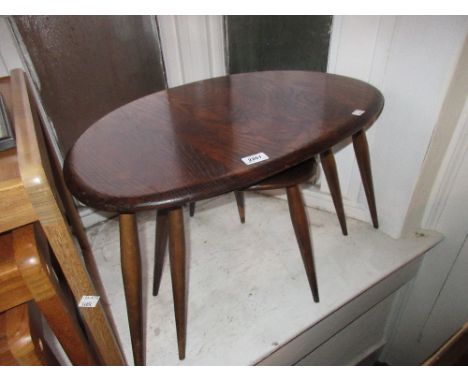 Nest of three Ercol dark elm coffee tables CONDITION REPORT Although the wood is in good condition, they have been changed in