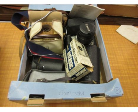 Two Kodak Box Brownie cameras, a Canon camera and other photographic accessories